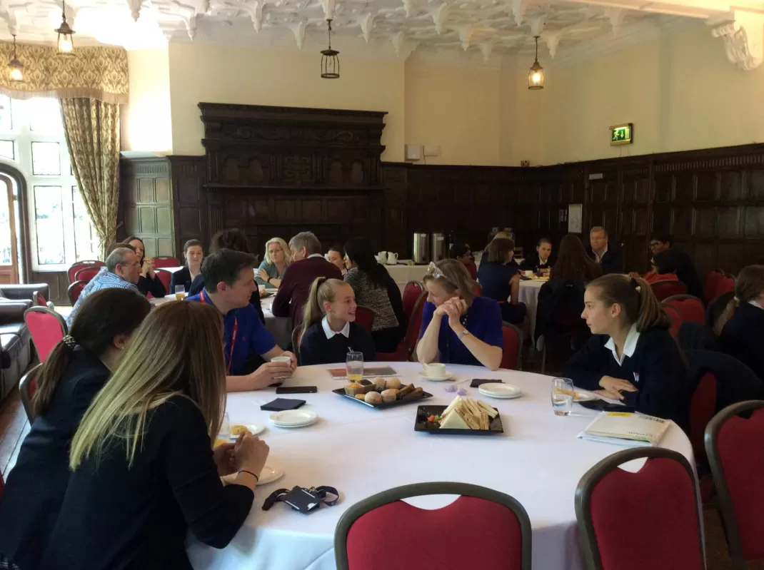 Intellectual Discussion Over Tea and Cake